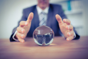 Businessman forecasting a crystal ball in the office