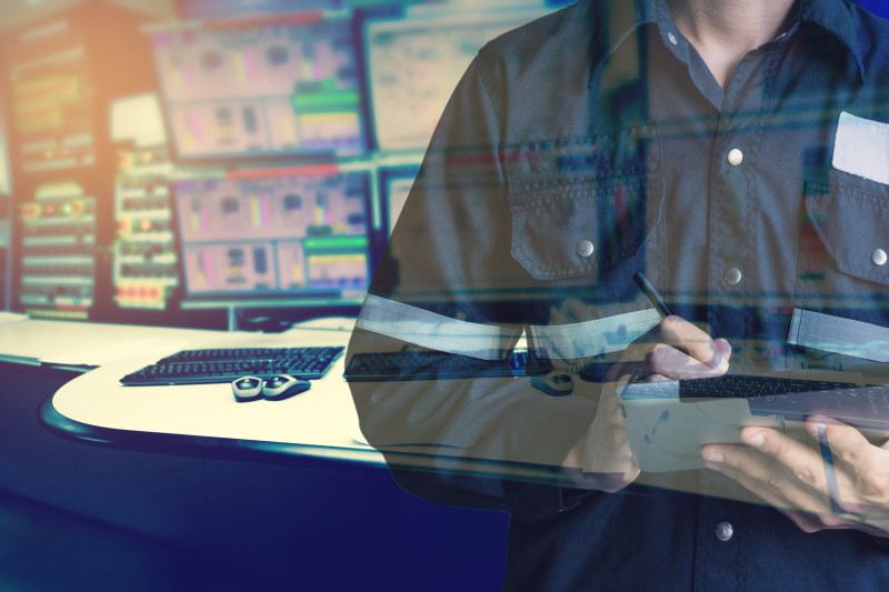Double exposure of Engineer or Technician man in working shirt