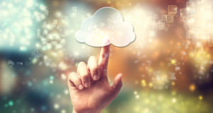 Cloud computing symbol being pressed by hand