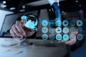 double exposure of hand showing Internet of things (IoT) word di