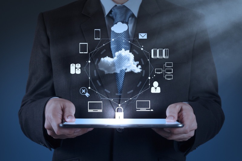 Businessman working with a Cloud Computing diagram on the new co