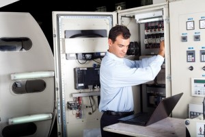 technician repairing computerized machine